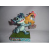 Figurine - Disney - Traditions - Stitch Running off with Easter Bakset - Enesco
